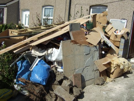 Efficient house clearance team managing items in a Hackney home